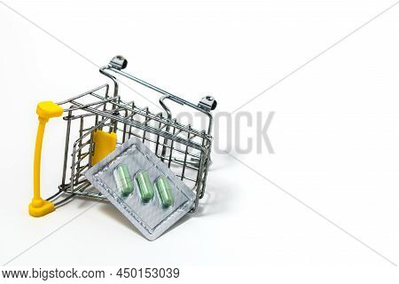 Green Chiretta Herbal Capsule In The Shopping Cart Against White Background For Healthcare And Medic