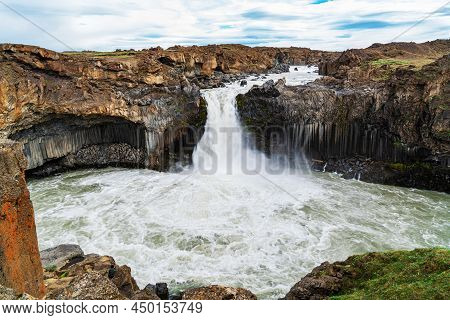 View Of Beautiful Aldeyjarfoss Waterfall With Beautiful Pattern Of The Cliff And The Field Of Lava R