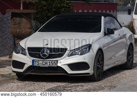 Side, Turkey -february  13, 2022: White Mercedes-benz E-class Is Parked  On The Street On A Warm  Da