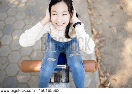 Top View,asian Schoolgirl Practicing Fitness,doing Sit Up Exercise For Health And Strength In Outdoo