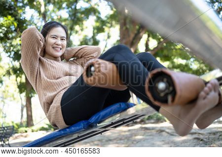 Beautiful Asian Woman Practicing Fitness,doing Sit Up Exercise For Health At City Park,happy Smiling