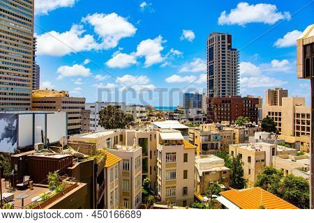 TEL AVIV, ISRAEL - JUNE 2, 2021: Israel, Tel Aviv. The famous building Migdal Shalom, in the past - the tallest building in the Middle East. Summer morning. Photo taken from the balcony of hotel.