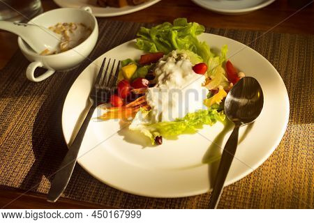 Ovelight On Vegetable Salad Topped With Natural Yoghurt On White Plate. Breakfast In Morning. Hight 