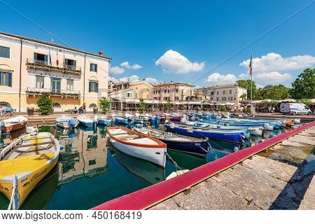 Bardolino, Italy - May 26, 2021: Small Port Of The Lake Garda (lago Di Garda) With Fishing Boats Moo
