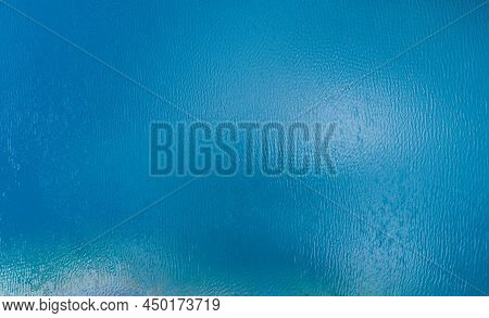 Aerial View Of A Blue Sea Surface Water Texture Background And Sun Reflections Aerial Flying Drone V