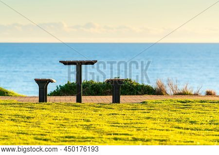 Picnic Table At Maslin Beach Sea Shore At Sunset, South Australia