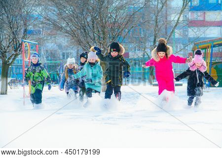 Alchevsk, Ukraine - January 26, 2022: Kindergarten Children On A Winter Walk