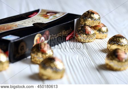 Kharkov, Ukraine - April 19, 2021: Henry Lambertz Mozart-kugeln Luxury Dark Chocolate Candies In Bla