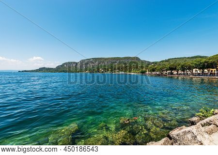 Beautiful Bay Of Water In Front Of Garda Town, Tourist Resort On The Coast Of Lake Garda (lago Di Ga