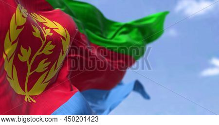 Detail Of The National Flag Of Eritrea Waving In The Wind On A Clear Day. Eritrea Is A Country In Th