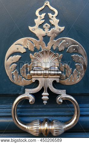 European Vintage Old Metal Wrought Iron Door Knocker. Design Detail. Paris.