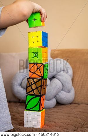 Closeup Cute Baby Boy Hands Building Rubiks Cubes Tower Having Fun Playing Early Development