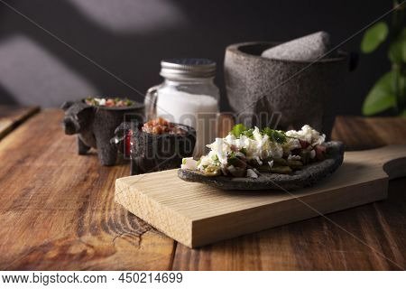 Tlacoyo With Nopales And Salsa. Mexican Pre Hispanic Dish Made Of Blue Corn Flour Patty Filled With 
