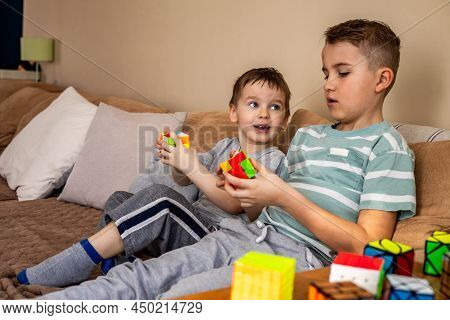 Two Male Kids Brothers Assembling Rubiks Cube Thinking Solving Logic Decision