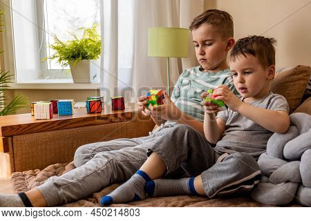 Two Male Kids Brothers Assembling Rubiks Cube Thinking Solving Logic Decision