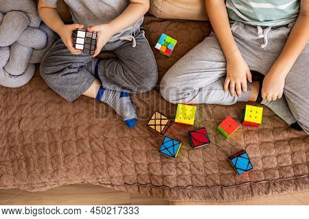 Two Male Kids Brothers Assembling Rubiks Cube Thinking Solving Logic Decision