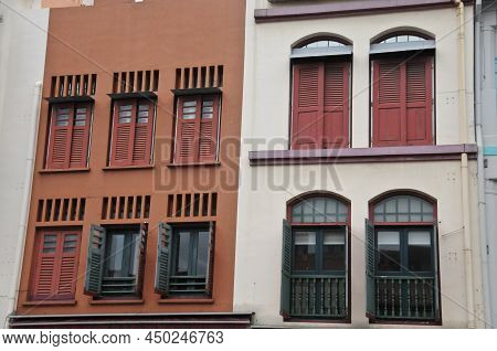 Classical Dark Orange And White Grey Front Of Town Houses In Singapore In Cloudy Day