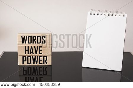 On Wooden Blocks The Words Words Have Power On A Black And White Background, The Concept Of Learning
