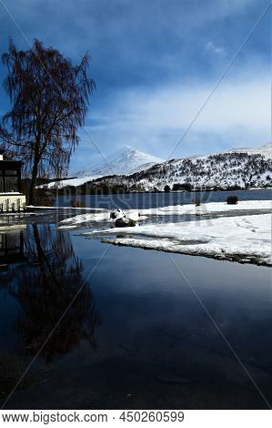 A View Across Loch Rannoch Toward The Mountain Of Schiehallion In Highland Perthshire During Winter 