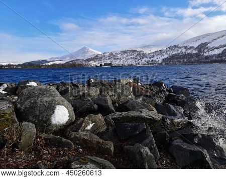 A View Across Loch Rannoch Toward The Mountain Of Schiehallion In Highland Perthshire During Winter 