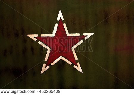 Red Star Symbol Printed On The Dark Green Background