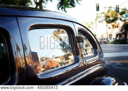 Vintage Car Windows Reflecting Summer Street Scape In The City