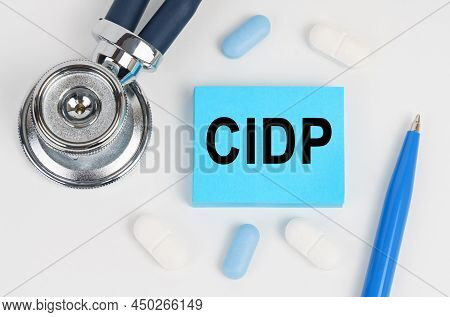 Medicine And Health Concept. On A White Surface Lie Pills, A Stethoscope And Stickers With The Inscr