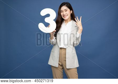 Young Beautiful Asian Woman Showing Number 3 And Pointing Up With Finger Number Three Isolated On Bl
