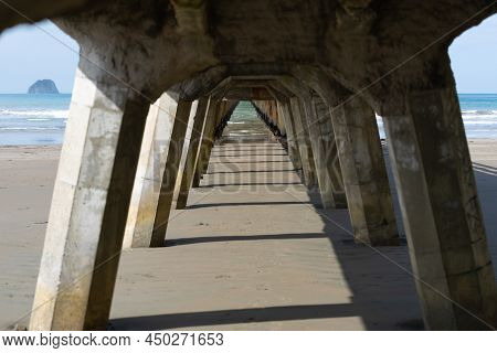 Long Repeating Pattern And Diminishing Perspective And Shadow Of Structure Underneath Tolaga Bay Wha