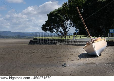 Old Style Sailer With Anchor High And Dry On Beach At Matua Tauranga.