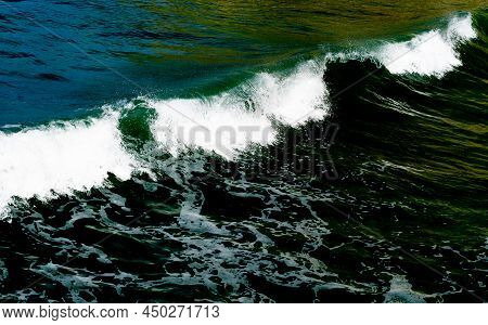 Surf Waves With White Water Crests Rolling In At Tolaga Bay, New Zealand.