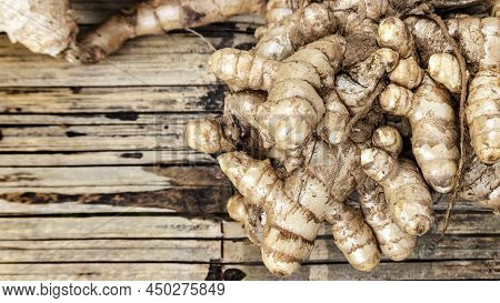 Harvest Ginger Root On Ratan Basket In Agriculture For Herb Ingredient In Thai Food