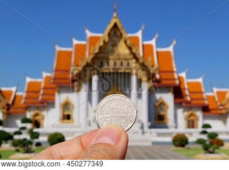 Closeup The Reverse Side Of 5 Thai Baht Coin In Hand Depicting Wat Benchamabophit Marble Temple, His