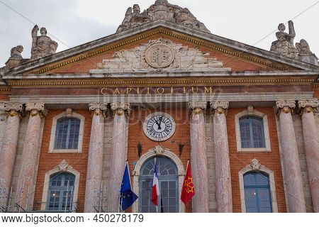 Toulouse , Occitanie , France - 02 20 2022 : Toulouse Facade Capitole City Hall In France With Flag 