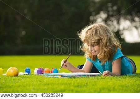 Schooler Kids Drawing In Summer Park, Painting Art. Little Painter Draw Pictures Outdoor. Happy Chil