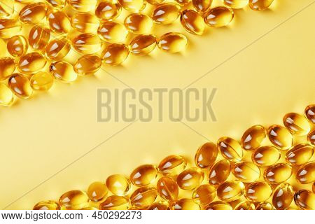 Capsules In A Shell With Liquid Vitamin D3 On A Yellow Background And A Place For Text