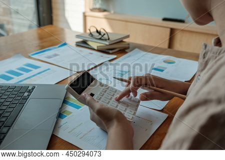 Business Woman Using Calculator For Analysis Maketing Plan, Accountant Calculate Financial Report, C