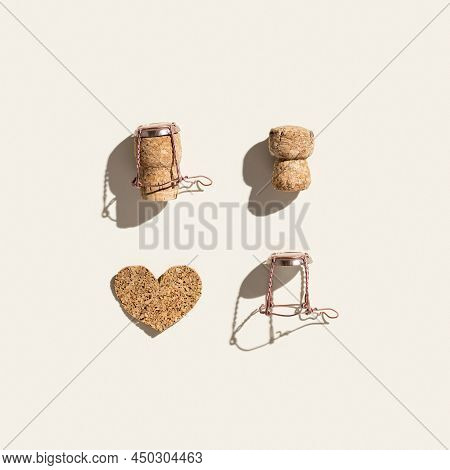 Flat Lay With Champagne Cork And Heart On Beige Background With Hard Light At Sunlight. Champagne Lo