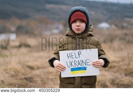 Help Ukraine. War Of Russia Against Ukraine. Ukrainian Crying Boy Asks To Stop The War In Ukraine. C
