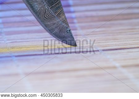 Hand-forged Knife Made Of Several Layers Of Steel With An Exclusive Pattern Photographed In The Stud