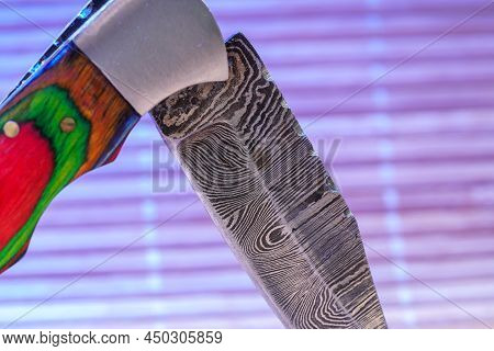 Hand-forged Knife Made Of Several Layers Of Steel With An Exclusive Pattern Photographed In The Stud