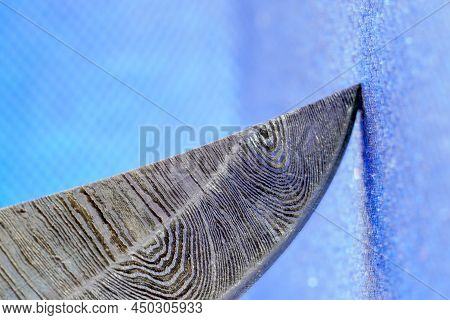 Hand-forged Knife Made Of Several Layers Of Steel With An Exclusive Pattern Photographed In The Stud
