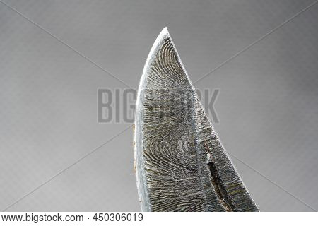 Hand-forged Knife Made Of Several Layers Of Steel With An Exclusive Pattern Photographed In The Stud