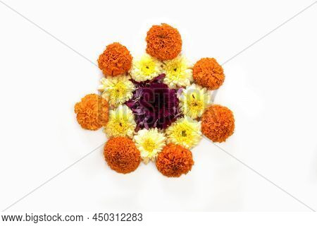 Flower Rangoli For Diwali Or Pongal Made Using Marigold Or Zendu Flowers And Red Rose Petals Over Wh