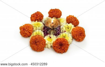 Flower Rangoli For Diwali Or Pongal Made Using Marigold Or Zendu Flowers And Red Rose Petals Over Wh