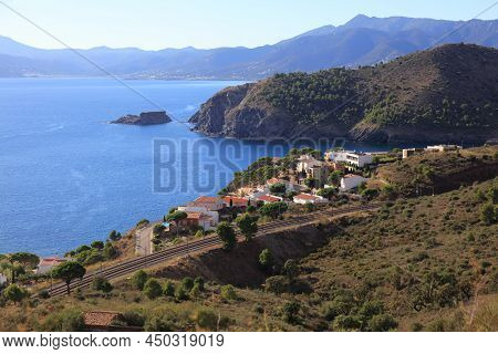 Colera Fishing Harbor In Spain. Town In Alt Emporda County Of Catalonia, Spain. Coastal Railway Line