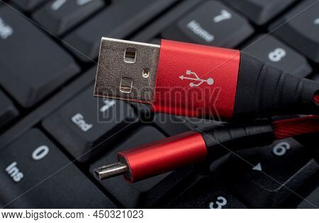 The Usb Cable For Charging Peripherals Is On The Keyboard In Black