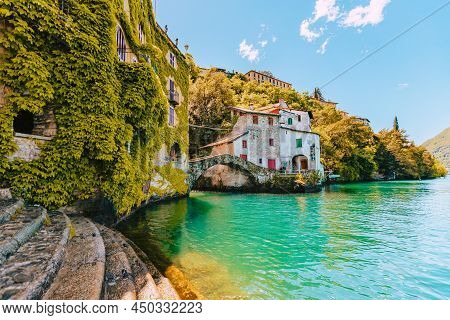 Nesso, Italy - May 2021: Village Of Nesso With The Medieval Bridge, Also Called Civera Bridge, On La