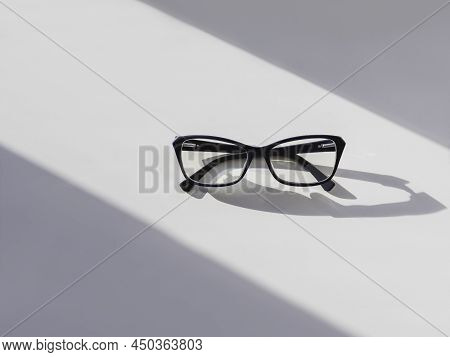 Top View Of Eyeglasses On White Background. Comfortable Life With Poor Eyesight. Ophthalmology. Cont