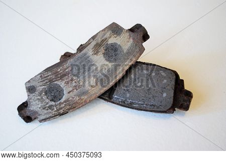 Pair Of Worn Out Ruined Disc Brake Pads